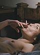 Noomi Rapace lying nude in bed and smoking pics