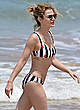 Lucy Hale wearing a bikini at a beach pics
