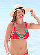 Danielle Lloyd wearing red bikini at a beach pics