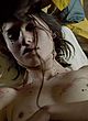 Simone Bucio lying nude & showing breasts pics
