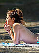 Blanca Blanco sunbathing topless on a beach pics