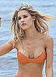 Joy Corrigan cleavage in orange bikini pics