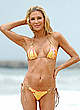 Brandi Glanville in yellow bikini on a beach pics