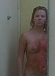 Charlize Theron standing, showing right breast pics