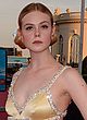 Elle Fanning busty in a low-cut gold gown pics