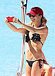 Andrea Corr in bikini on a beach and boat pics