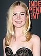 Elle Fanning cleavy in strapless lace gown pics