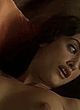 Penelope Cruz lying, showing breasts in bed pics