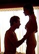 Kim Basinger undressing, exposing breasts pics