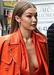 Gigi Hadid flashing tits in orange outfit pics