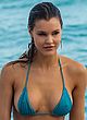Joy Corrigan blue bikini sideboob & pokies pics