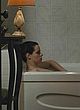 Emily Hampshire naked pics - nude tits, lying in bathtub