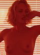 Amber Valletta posing, showing her breasts pics