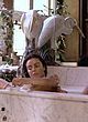 Tracy Scoggins exposing left boob in bathtub pics