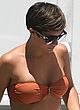 Frankie Sandford busty & booty in orange bikini pics