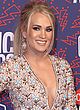 Carrie Underwood showing huge cleavage & leggy pics
