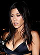 Kourtney Kardashian busty in tiny bra-top outdoor pics