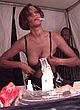 Whitney Houston naked pics - boob as she adjusts her bra
