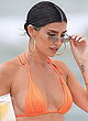 Nicole Williams busty in a tiny orange bikini pics