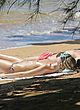 Margot Robbie sunbathing topless at beach pics