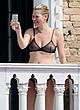 Kate Moss naked pics - see through bra on a balcony