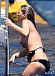 Kate Moss climbing on board a yacht pics
