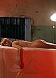 Bai Ling naked pics - lying on table, showing butt