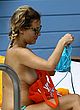 Caroline Flack naked pics - putting on bikini by the pool