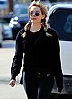 Elizabeth Olsen leggy in tights outdoor pics