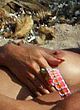 Heidi Klum sunbathing topless on beach pics