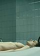 Alba Ribas naked pics - lying on table exposing boobs