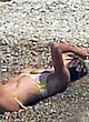 Heidi Klum naked pics - lying topless on the beach