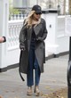 Rita Ora looks chic in a leather coat pics