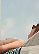 Dakota Johnson boobs out while sunbathing pics