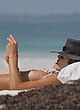 Ashley Hart naked pics - sunbathing topless on beach