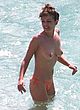 Elizabeth Hurley naked pics - exposing her tits at the beach