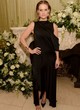 Alice Eve posing sexy in black gown pics