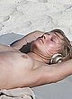 Toni Garrn naked pics - sunbathing topless on beach