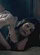 Gemma Arterton lying and flashing breasts pics