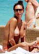Lilly Becker sunbathing topless on beach pics