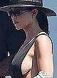 Kourtney Kardashian naked pics - showing side-boob in bikini
