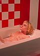 Augie Duke naked pics - lying topless in bathtub