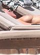 Kristen Hancher showing boobs & sunbathing pics