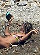 Heidi Klum lying on the beach topless pics