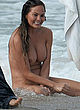 Chrissy Teigen posing fully naked in water pics