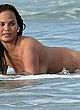 Chrissy Teigen fully naked posing in water pics