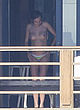 Cara Delevingne naked pics - sunbathing topless on balcony