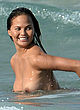Chrissy Teigen posing sexy & topless in water pics