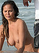 Chrissy Teigen naked pics - topless on the beach, posing