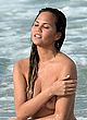 Chrissy Teigen naked pics - posing for photoshoot, beach